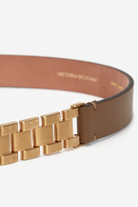 Close-up of a Victoria Beckham Watch Strap Detail Belt in Khaki-Brown with a golden metallic buckle, showing detailed texture and calf-leather finish inside.