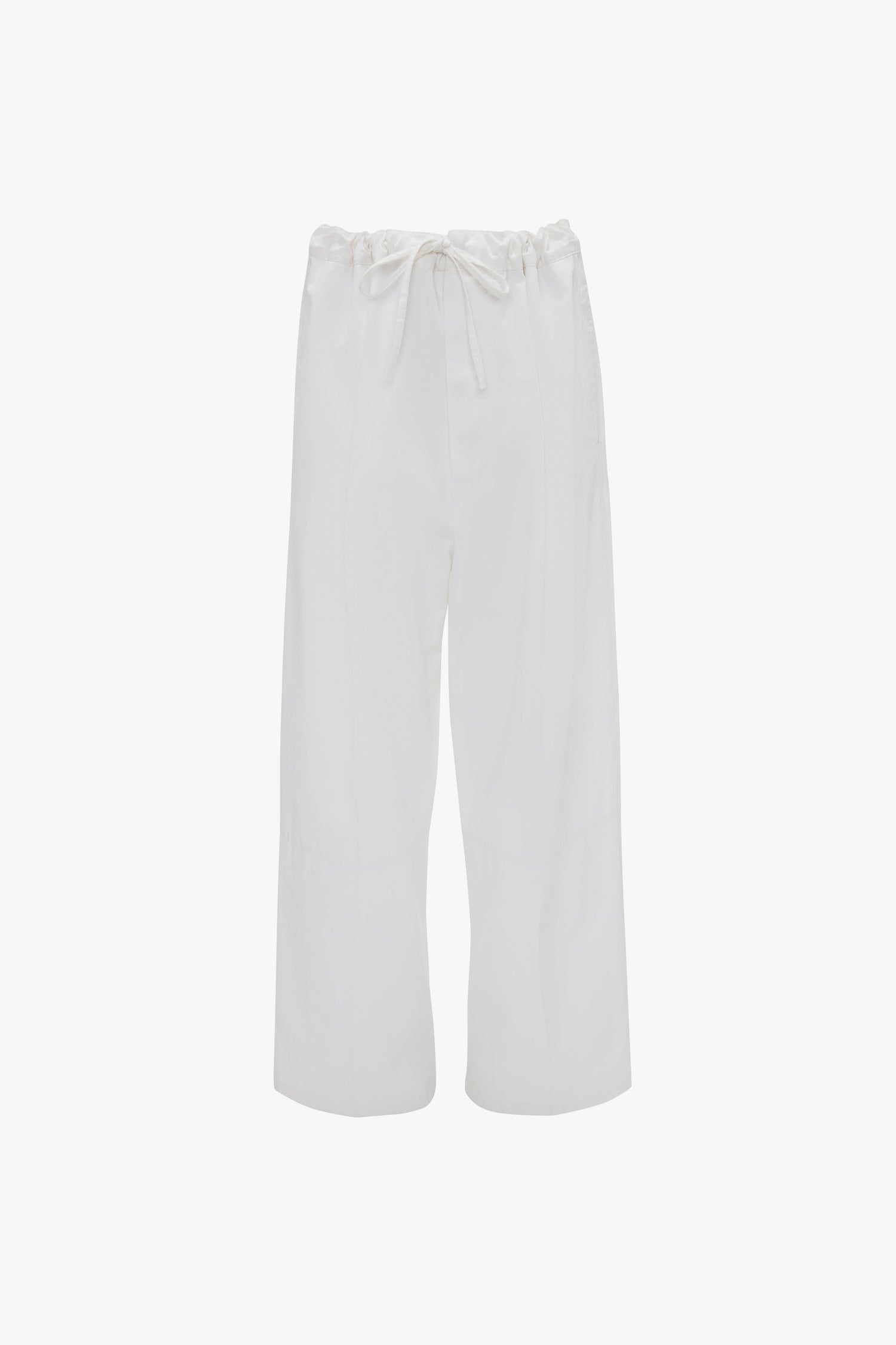 White wide-leg drawstring pyjama trousers in washed white by Victoria Beckham isolated on a white background.