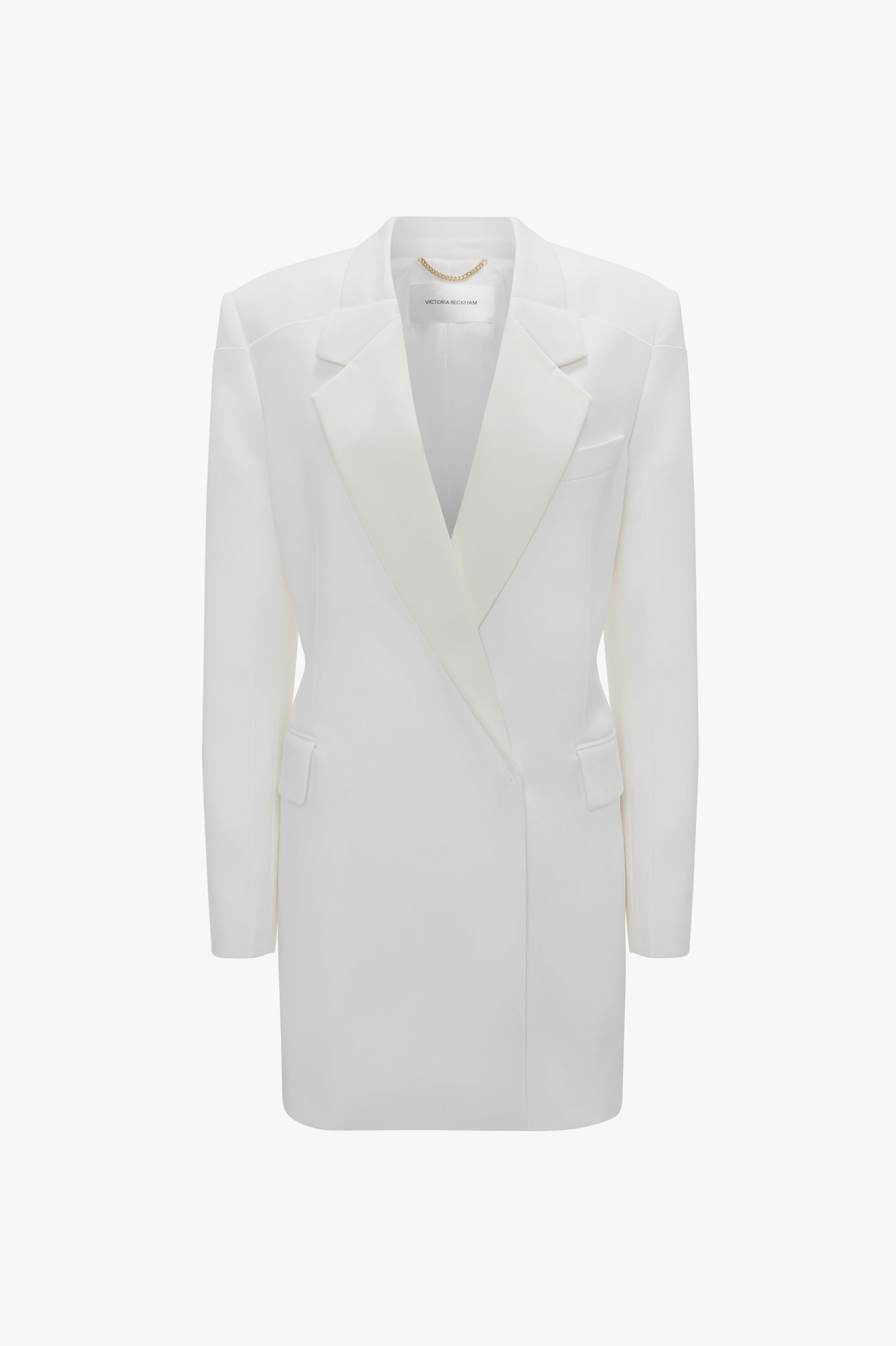 A Victoria Beckham Exclusive Fold Shoulder Detail Dress In Ivory with sharp lapels and a double-breasted cut, showcased against a plain background.