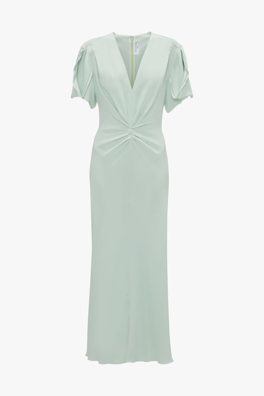 A light green Gathered V-neck midi dress in Jade with twisted front design and short ruffle sleeves, displayed on a white background by Victoria Beckham.