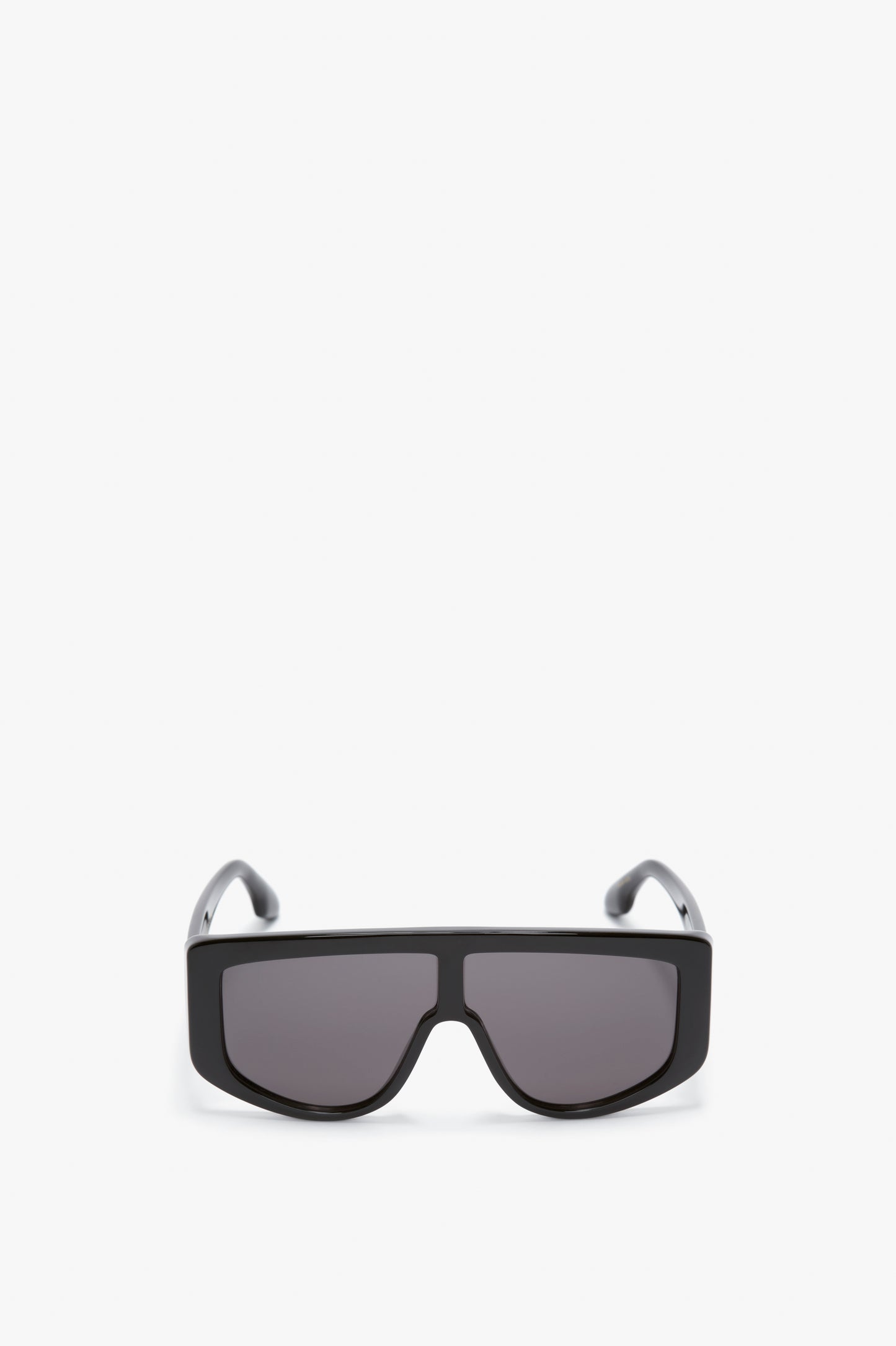 Victoria Beckham Acetate Visor Sunglasses In Black, black rectangular sunglasses with oversized frames and dark tonal lenses, displayed against a white background.