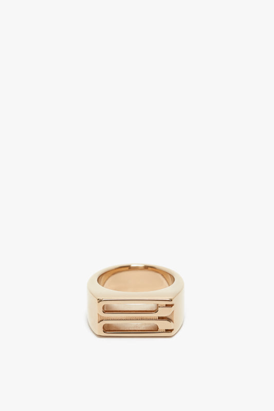 Exclusive Frame Signet Ring In Gold by Victoria Beckham, with a bold, geometric design featuring layered bands, isolated on a white background.