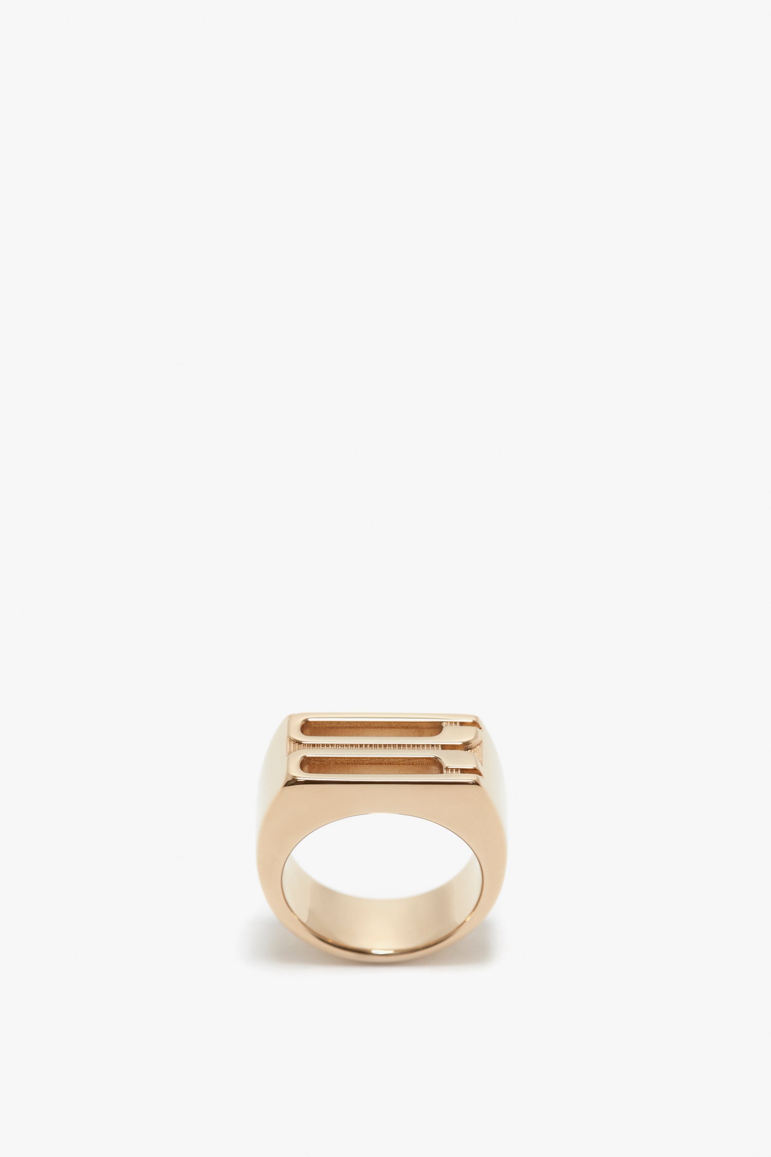 A minimalist Exclusive Frame Signet Ring In Gold by Victoria Beckham with a sleek, slightly rectangular design, displayed against a plain white background.