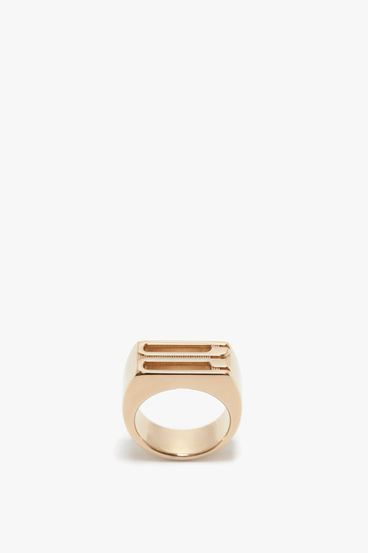 A minimalist Exclusive Frame Signet Ring In Gold by Victoria Beckham with a sleek, slightly rectangular design, displayed against a plain white background.