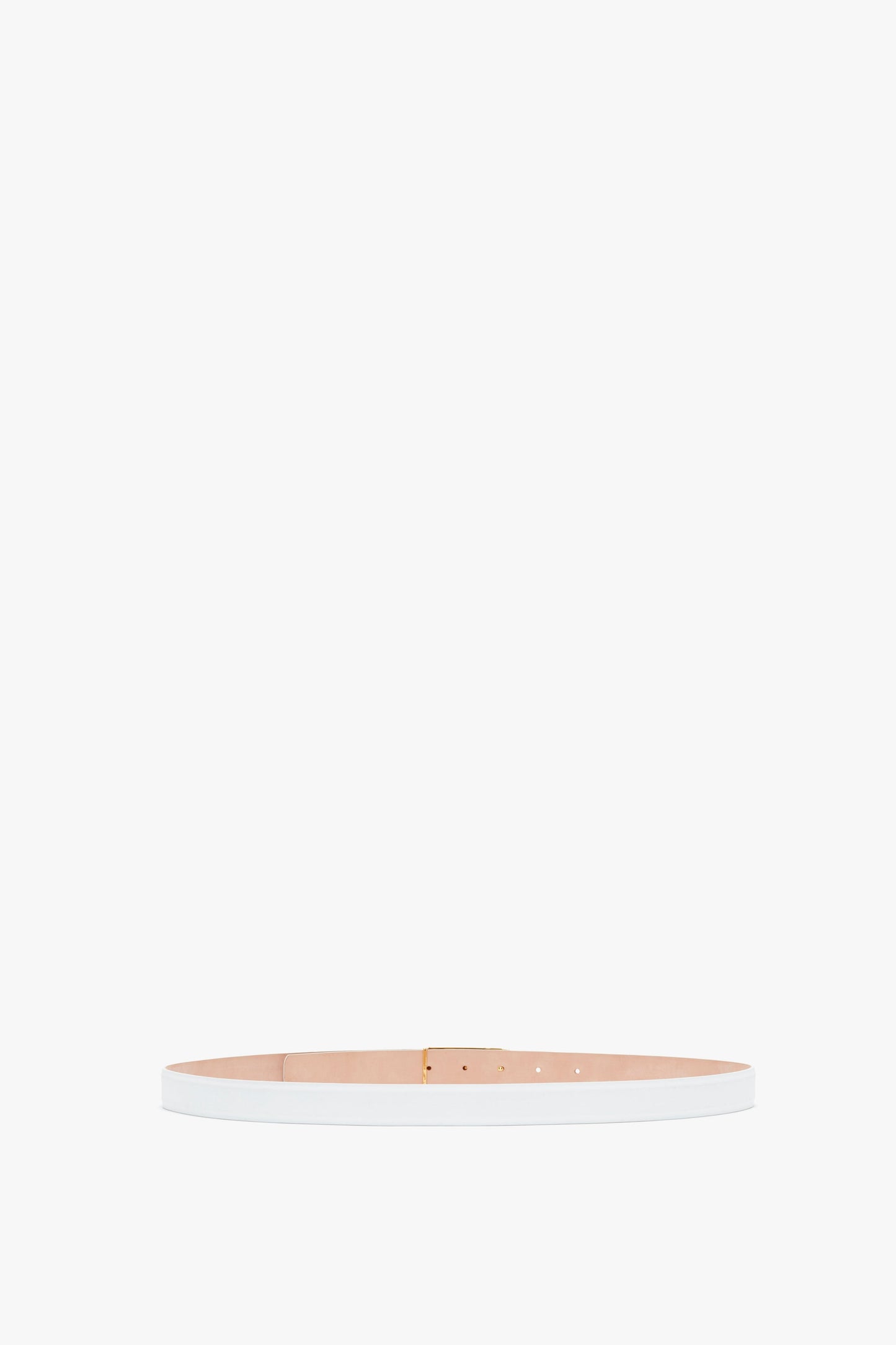A pale pink smooth calf leather Exclusive Frame Belt with gold hardware, laid out straight on a white background by Victoria Beckham.