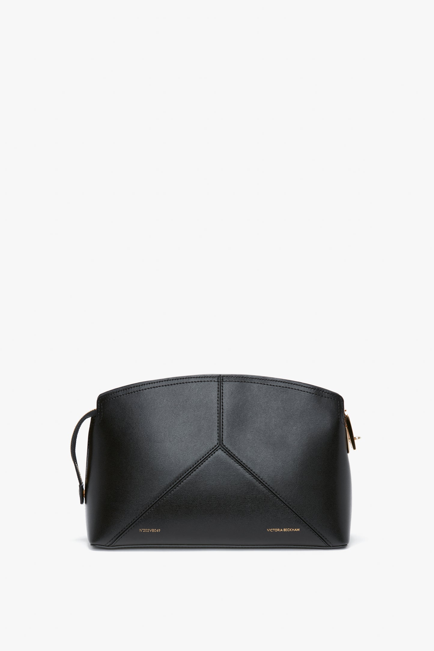 A Victoria Clutch Bag In Black Leather with minimal design and a zip closure, featuring subtle branding at the bottom, this piece boasts a structured silhouette by Victoria Beckham.