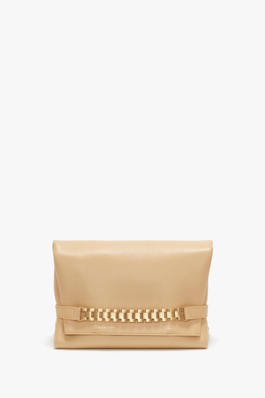 Beige leather chain pouch with strap in sesame leather, photographed against a plain white background, by Victoria Beckham.