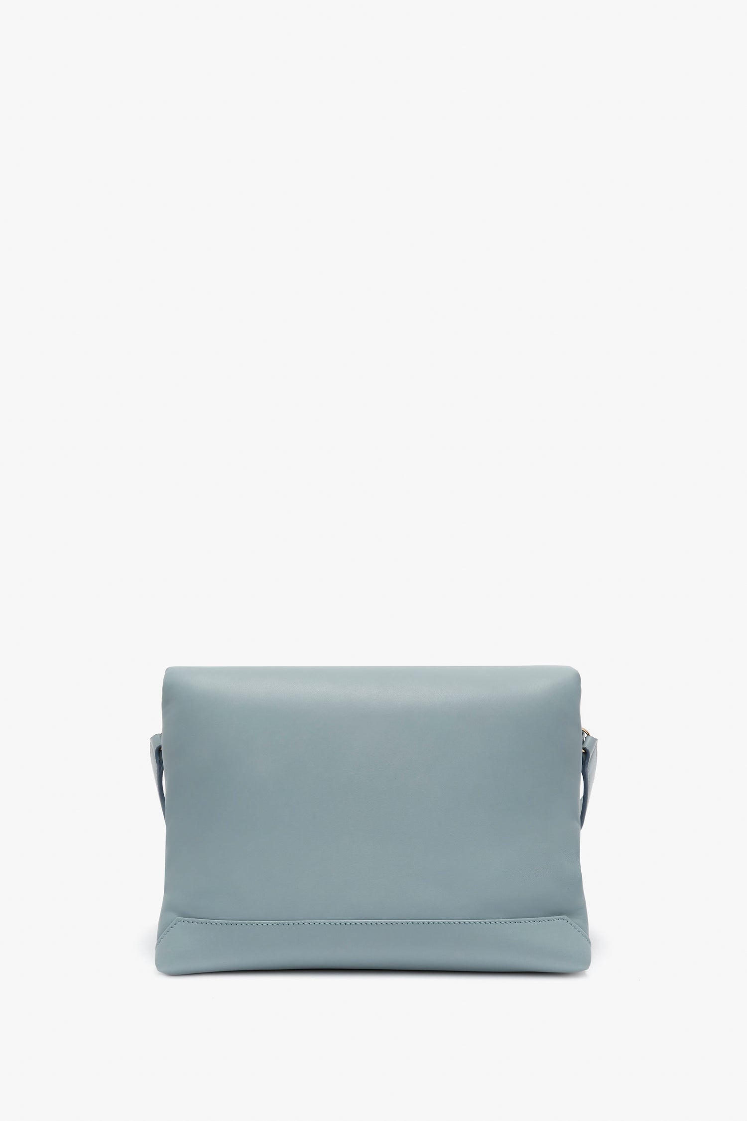 A light blue Puffy Chain Pouch With Strap In Ice Leather clutch bag by Victoria Beckham, displayed against a plain white background.