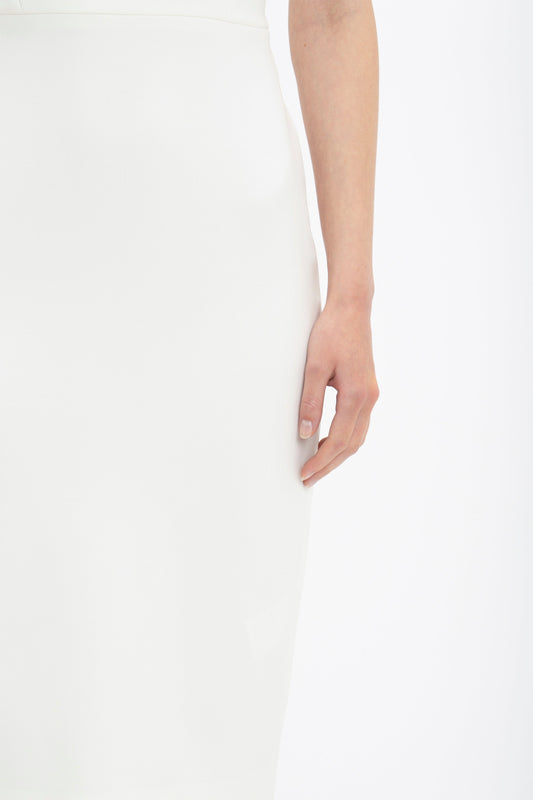 Close-up of a woman's side with her hand resting on her Victoria Beckham Fitted T-shirt Dress In Ivory.