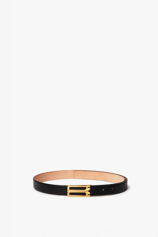 A Victoria Beckham black leather Frame Buckle Belt with a gold buckle, displayed against a white background.