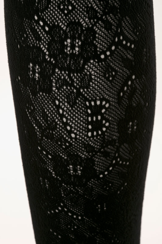 Close-up view of Exclusive VB Monogram Lace Tights in Black from Victoria Beckham, showcasing detailed seamless and sag-free construction.