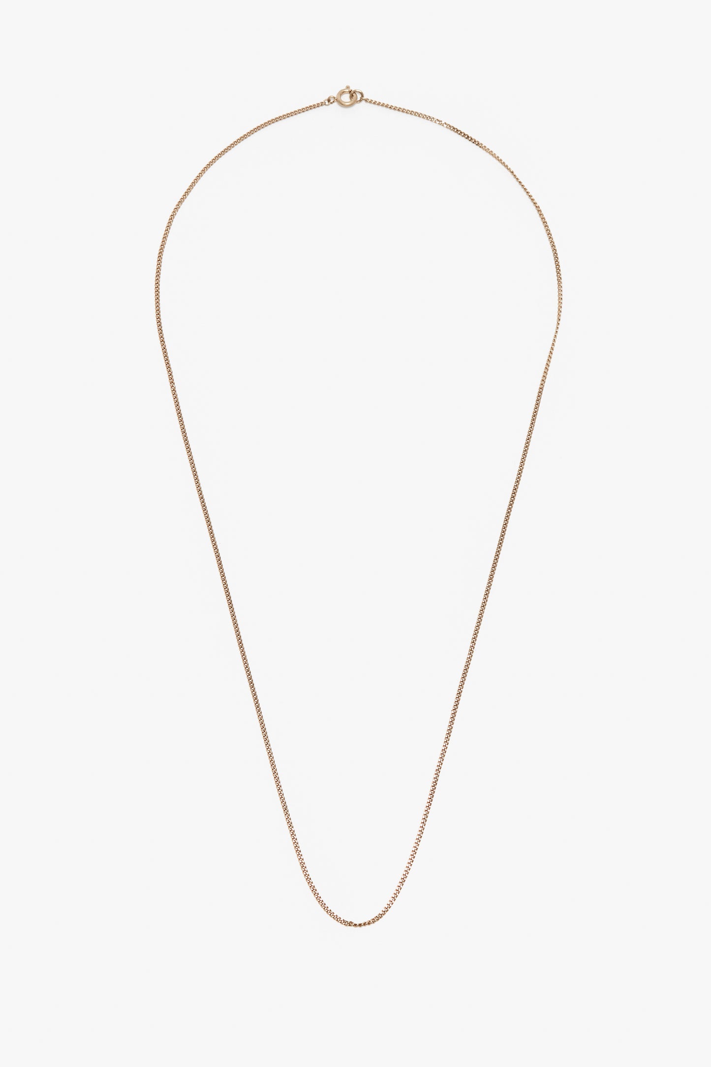 An Exclusive Long Fine Chain In Gold by Victoria Beckham, showcased delicately on a white background.