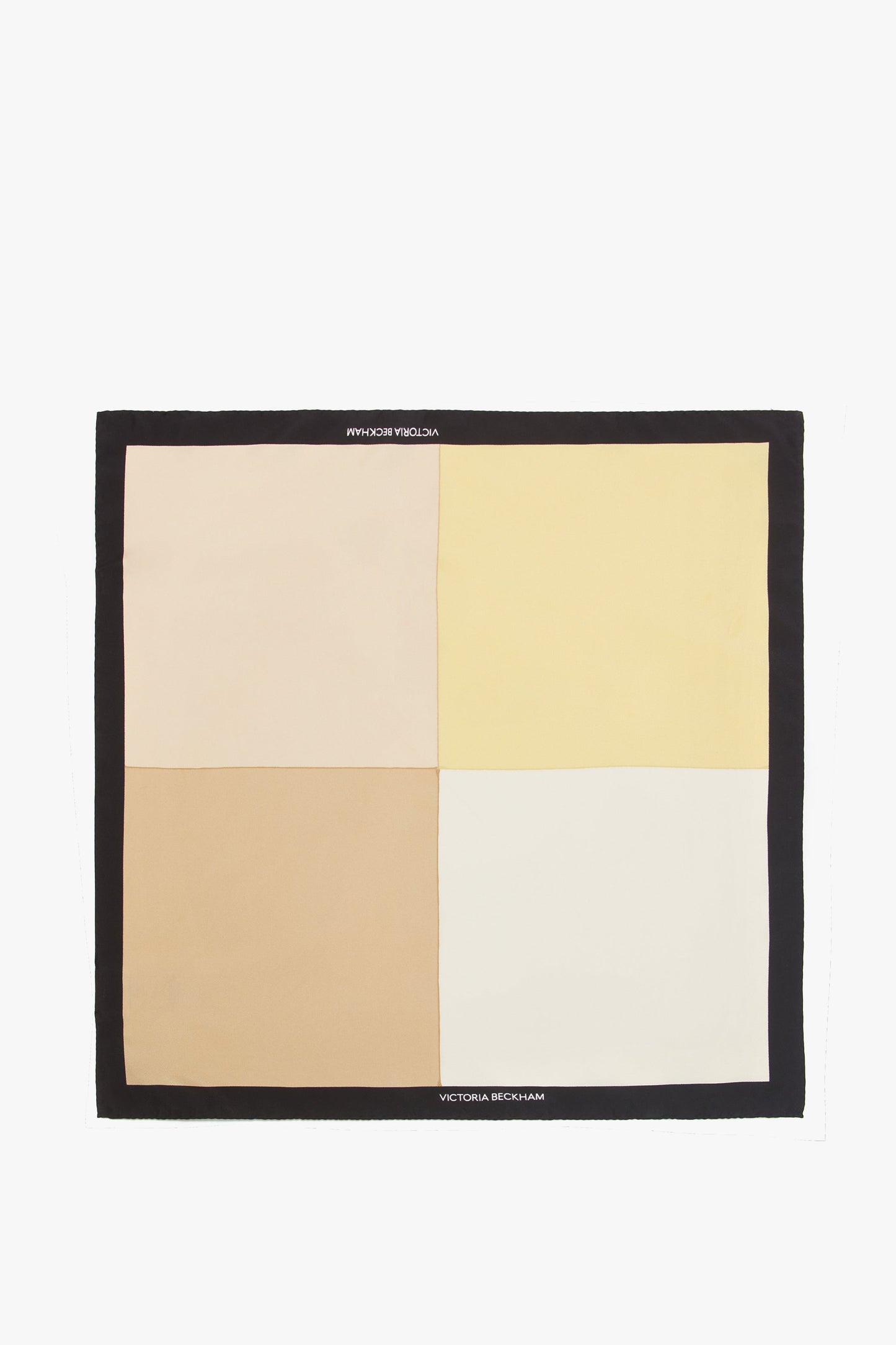 A sophisticated accessory, this luxurious Colour Block Silk Scarf In Macadamia by Victoria Beckham features four equal quadrants in beige, light pink, yellow, and off-white. It is bordered by a black edge with "Victoria Beckham" elegantly printed on two opposite sides.