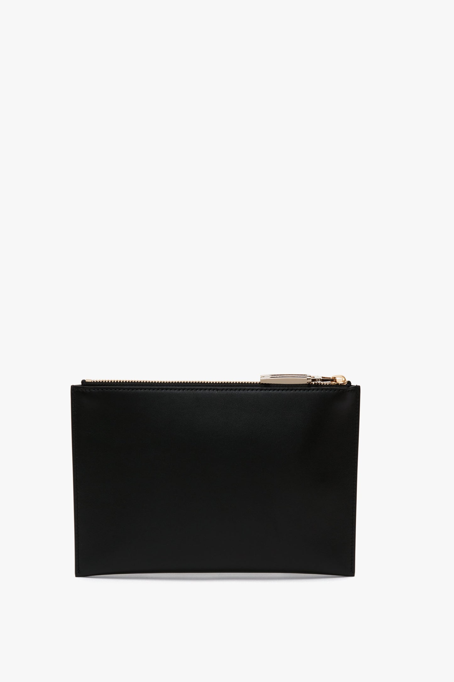 A Victoria Beckham B Frame Pochette Bag In Black Leather made from smooth calf leather with a visible gold zipper on top, showcasing a modern accessory against a white background.