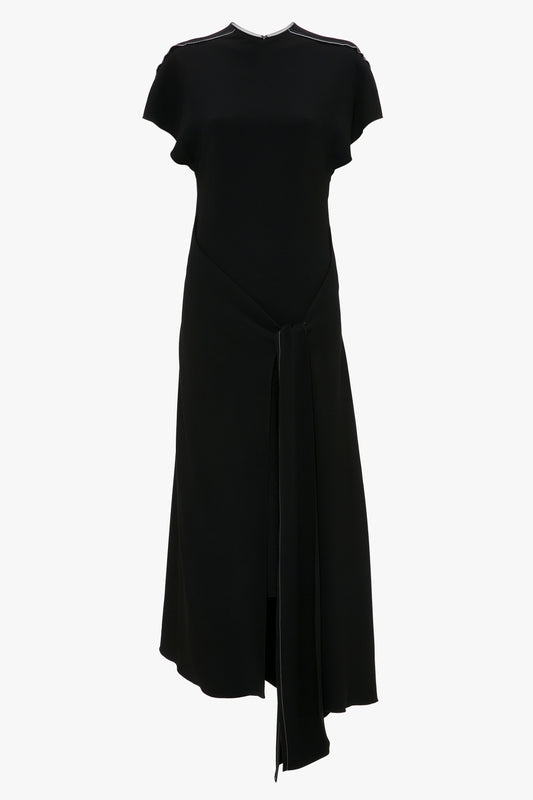 Victoria Beckham's Short Sleeve Tie Detail Dress In Black, displayed on a white background.