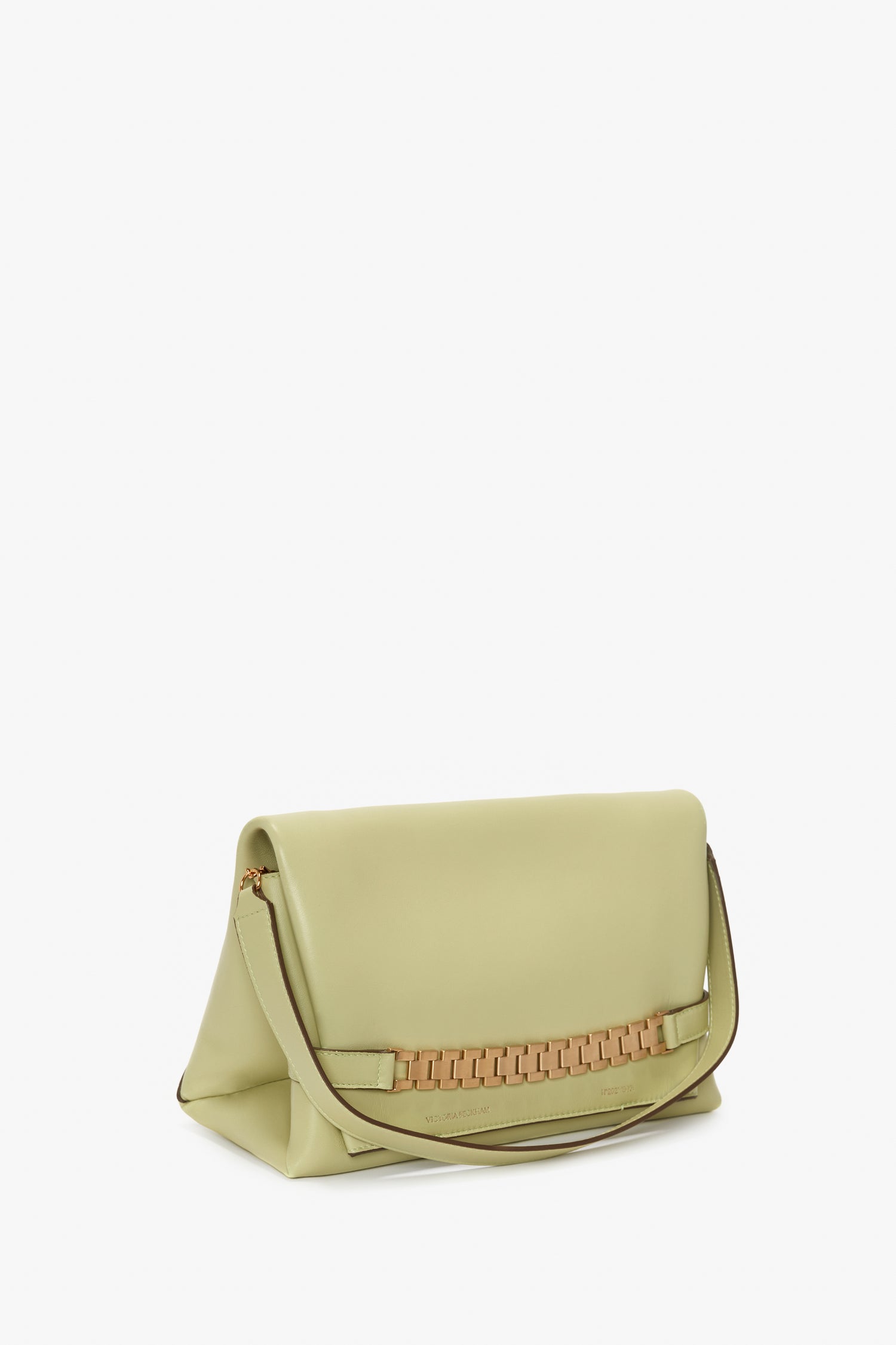 Light green Victoria Beckham leather shoulder bag with a fold-over flap and a gold chain detail, displayed against a white background.