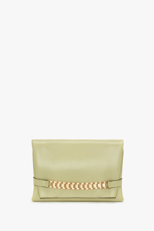 Avocado leather chain pouch with a gold chain detail on the front, against a white background, embodying Victoria Beckham's vintage elegance.