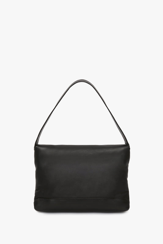 A Victoria Beckham Puffy Chain Pouch with Strap in black leather, displayed against a white background.