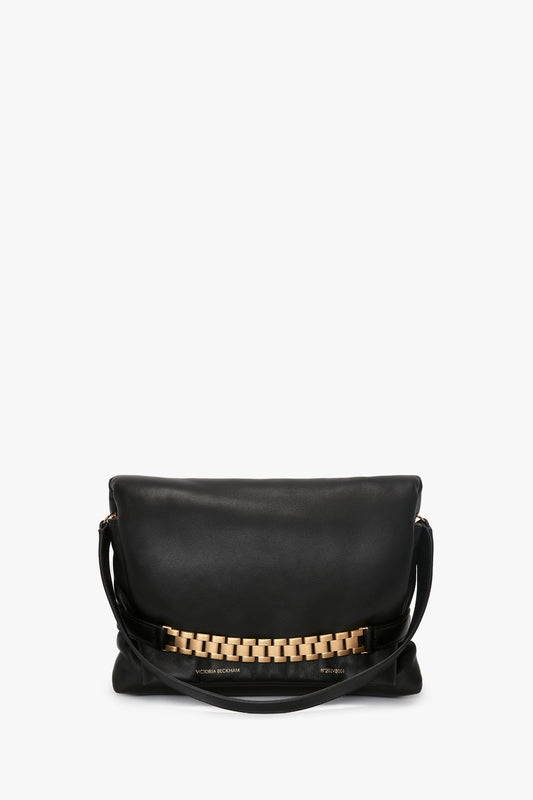 Puffy Chain Pouch With Strap In Black Leather handbag by Victoria Beckham, displayed against a white background.