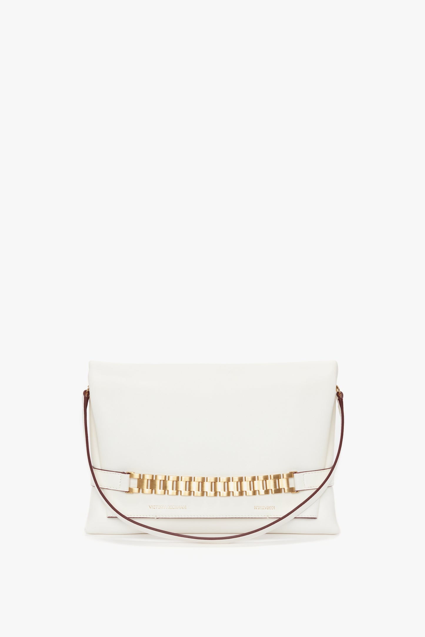 A white rectangular Chain Pouch Bag with Strap In White Leather by Victoria Beckham with a gold chain detail on the front and a thin maroon detachable strap.