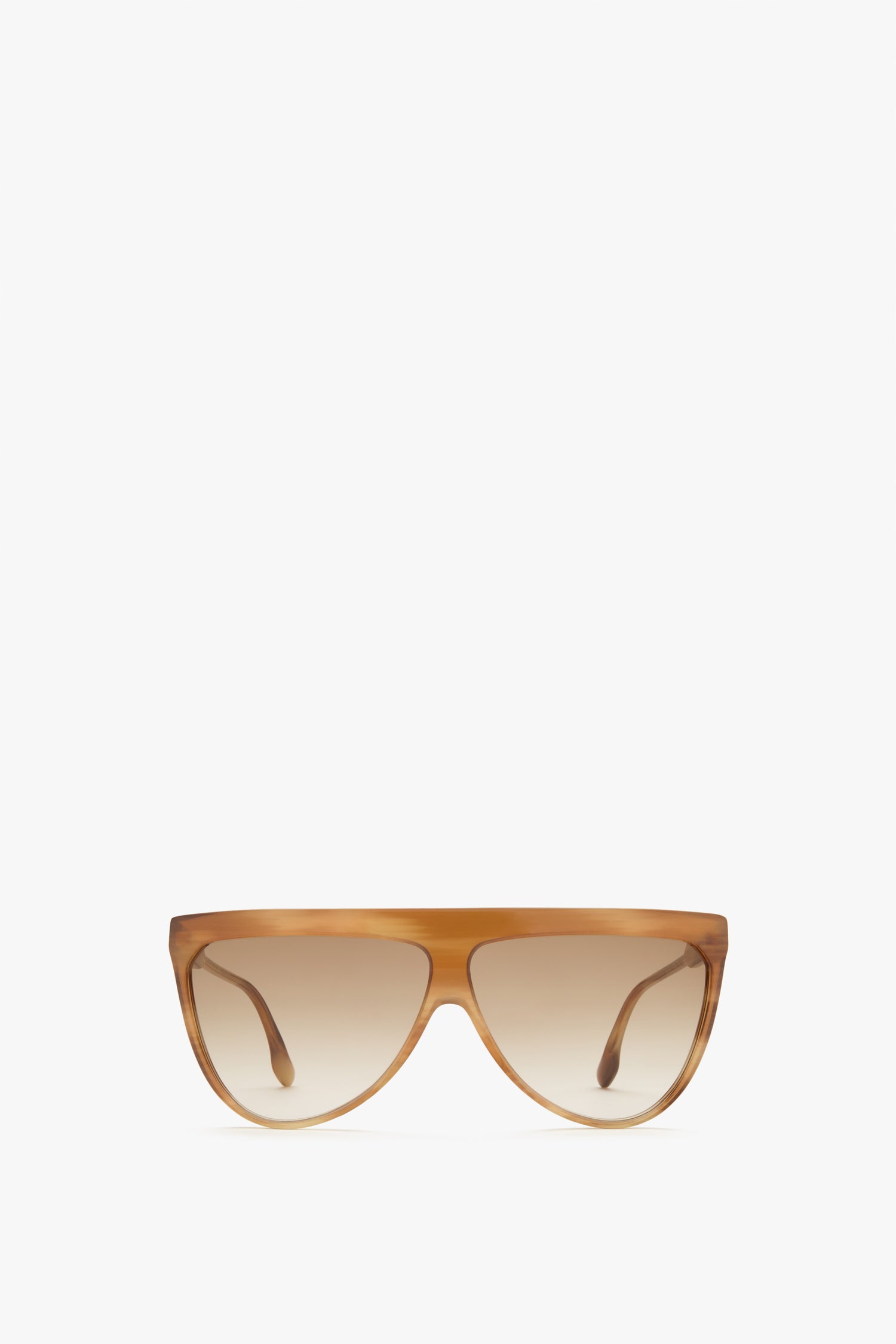 A pair of Victoria Beckham Classic Flat Top V Sunglasses in Honey Horn with a light brown frame and dark lenses, featuring luxurious horn-effect acetate, set against a plain white background.