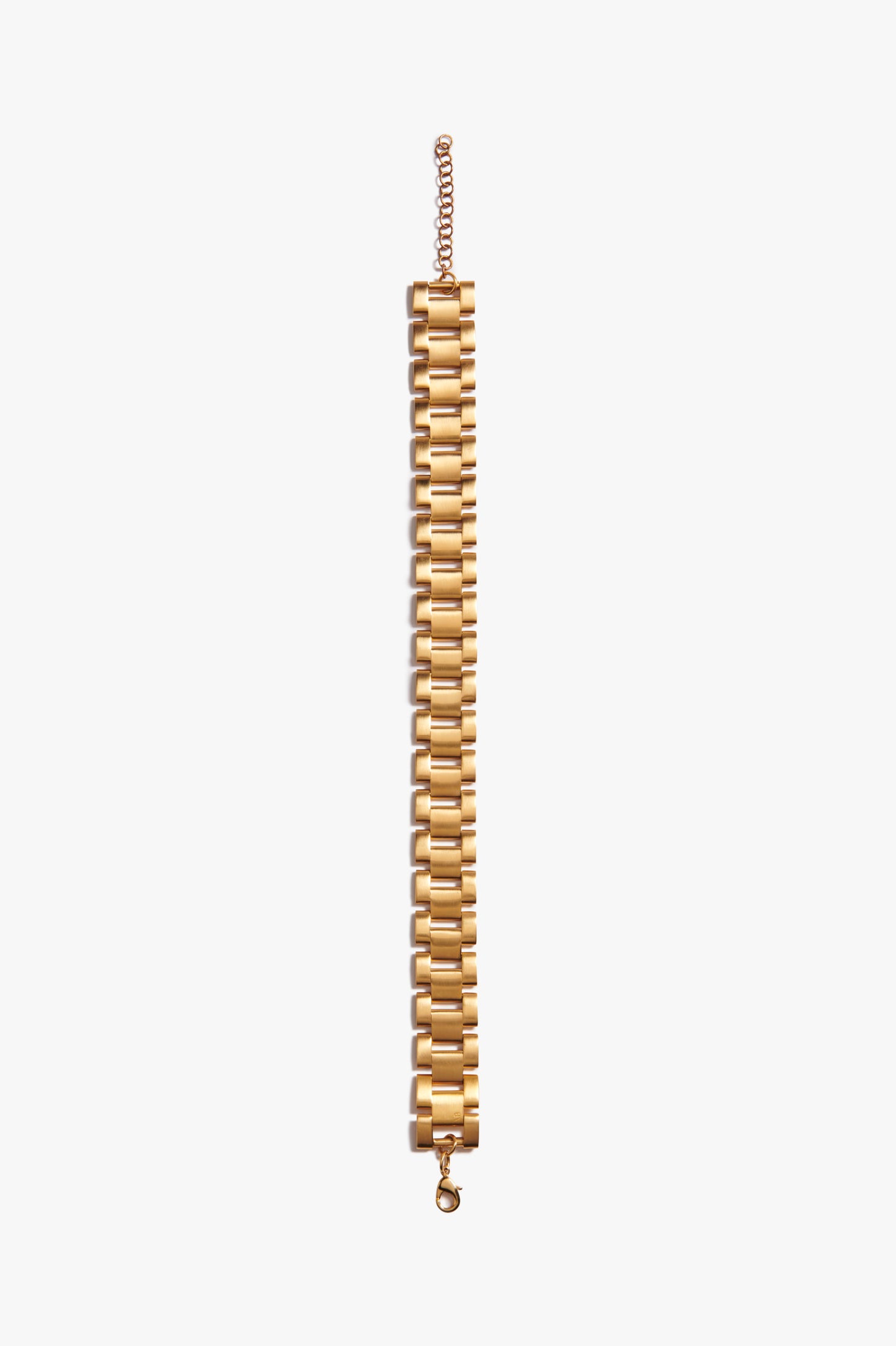 A Victoria Beckham Watch Chain Choker In Gold with a series of rectangular, watch-inspired links and an adjustable clasp, laid out flat on a white background.
