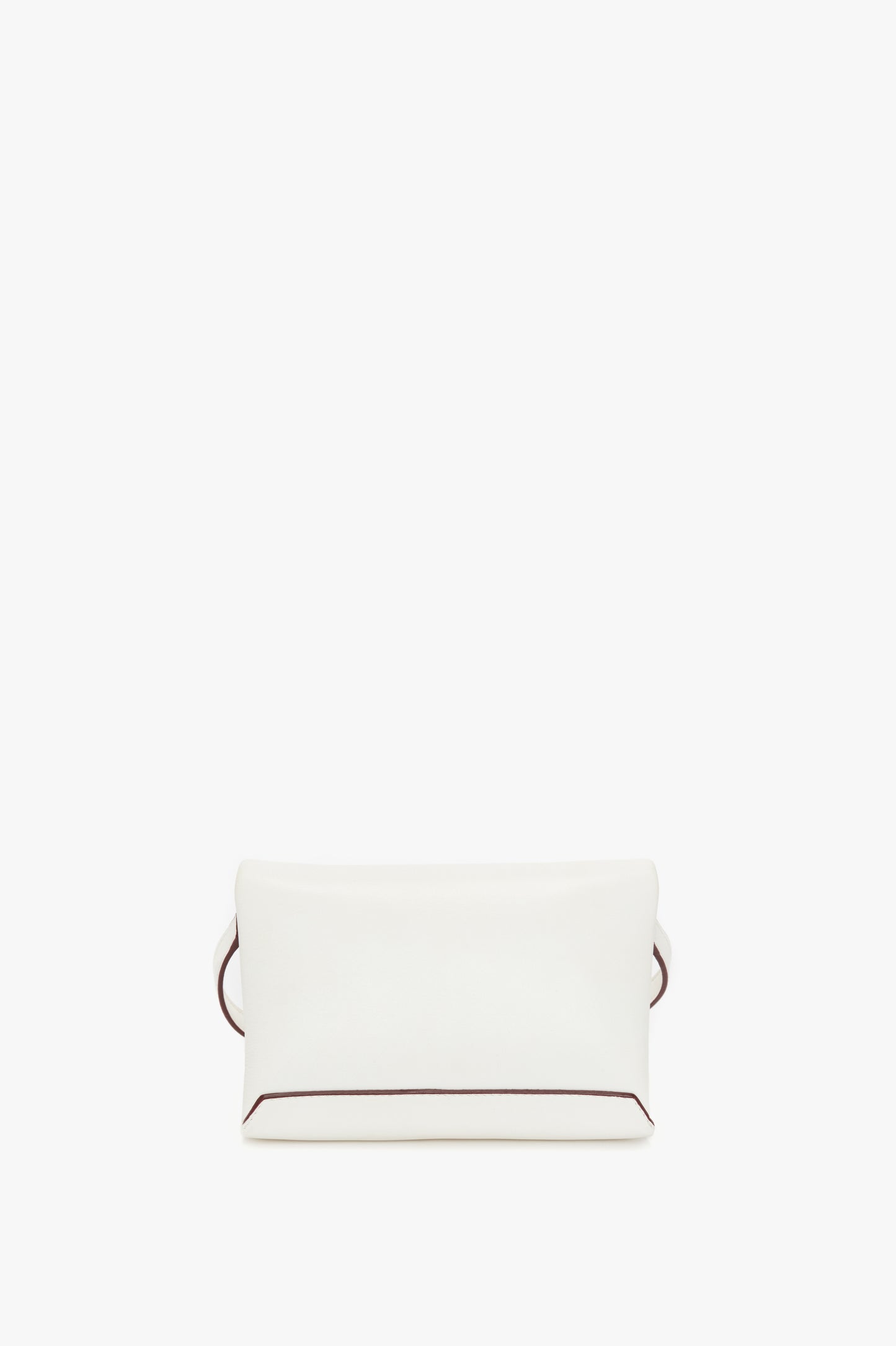 A plain white rectangular Mini Chain Pouch Bag In White Leather made from luxurious Nappa leather, featuring a minimalistic design, subtle brown trim on the edges, and a convenient detachable strap by Victoria Beckham.