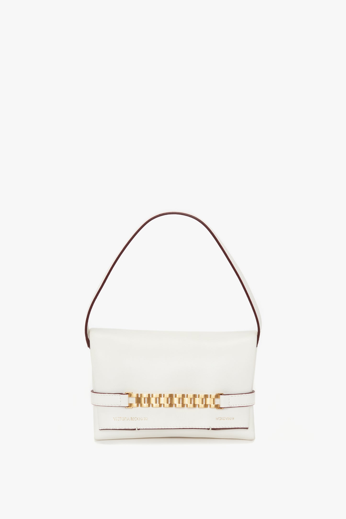 A Victoria Beckham Mini Chain Pouch Bag In White Leather crafted from Nappa leather with a short brown strap, a gold chain detail across the front, and featuring a detachable strap for versatile wear.