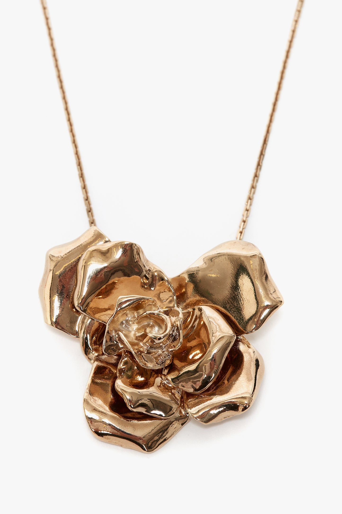 A statement accessory, this Exclusive Flower Necklace In Gold by Victoria Beckham features a rose-shaped pendant with detailed petals.