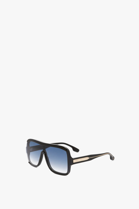 A pair of Victoria Beckham Layered Mask Sunglasses in Black Gradient with thick frames and reflective black lenses, isolated on a white background.