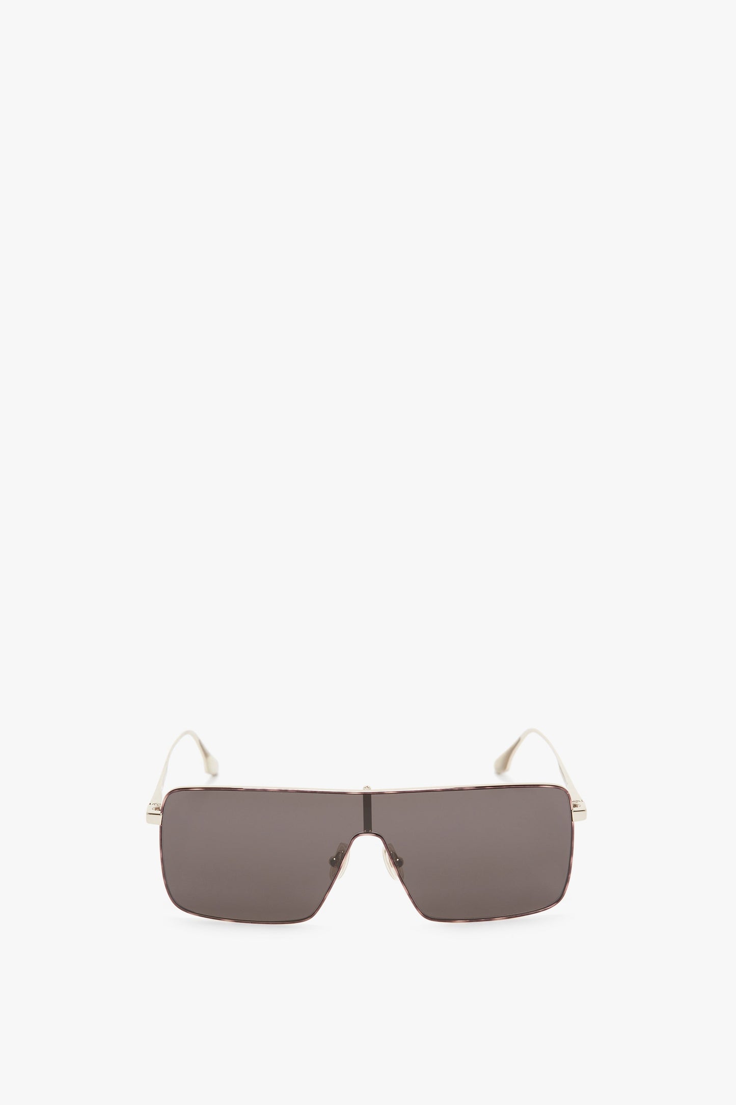 A pair of Victoria Beckham Rectangular Visor In Gold-Smoke sunglasses with rectangular dark lenses and thin, light-colored gold frames, viewed from the front.