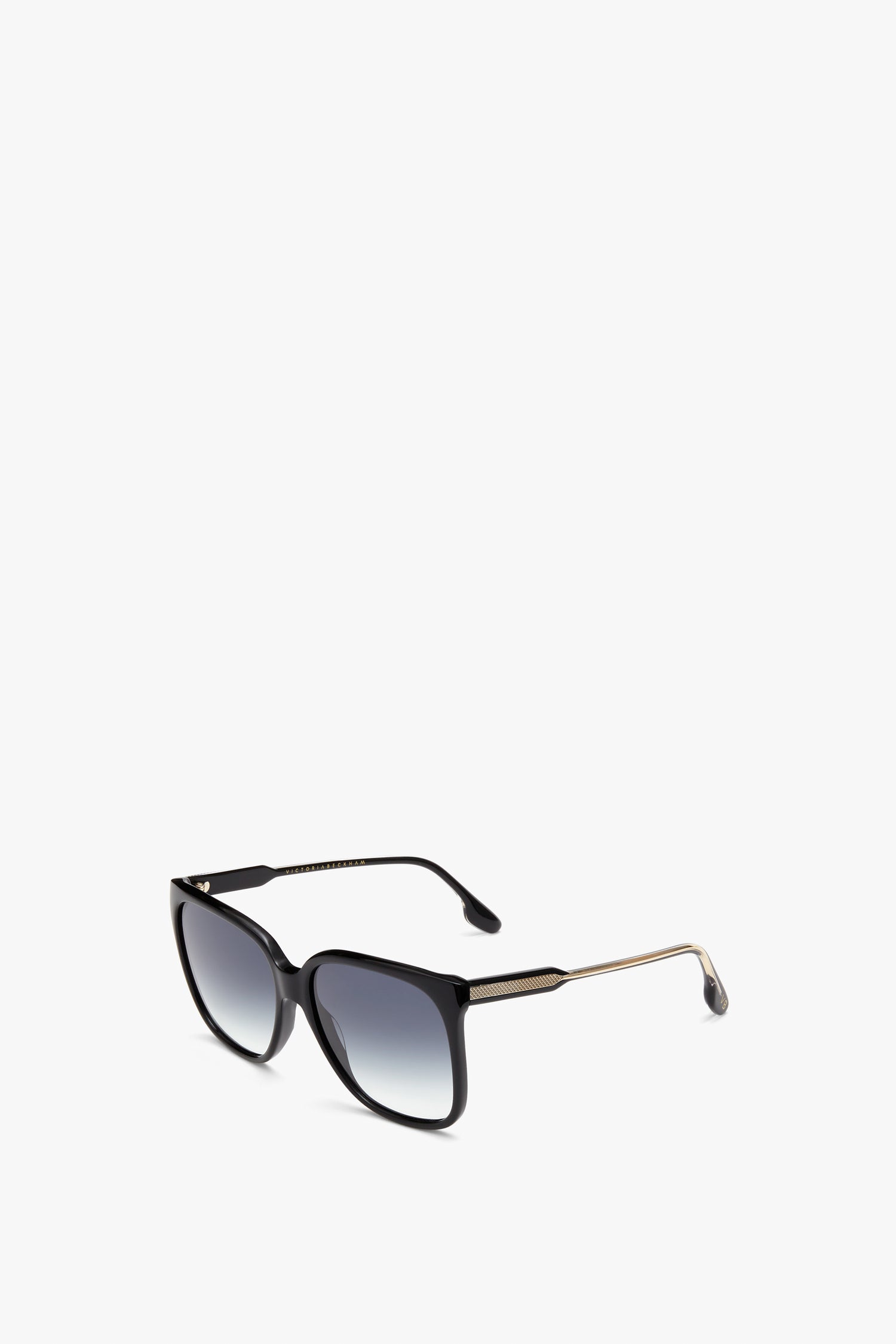 Black, square-framed Soft Square Sunglasses in Black with gradient lenses and gold-toned acetate temples, positioned slightly open on a white background. Providing stylish UV protection, these Victoria Beckham sunglasses are both trendy and functional.