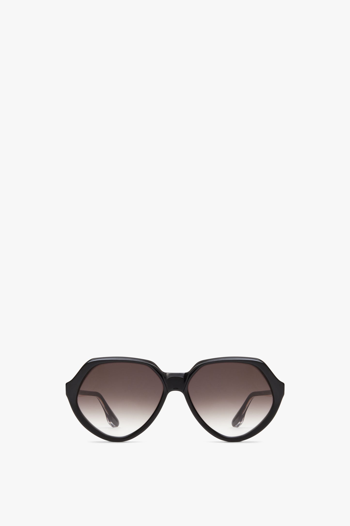 A pair of Victoria Beckham Faceted Round In Black sunglasses is centered against a white background.