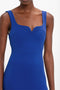 Close-up of a person wearing the Victoria Beckham Sleeveless Fitted T-Shirt Dress In Palace Blue with a sweetheart neckline.