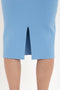 A close-up of the bottom half of a Fitted Midi Skirt In Marina by Victoria Beckham with a front slit, showcasing contemporary polish in its blue compact knit fabric, worn by a person standing on a white background.