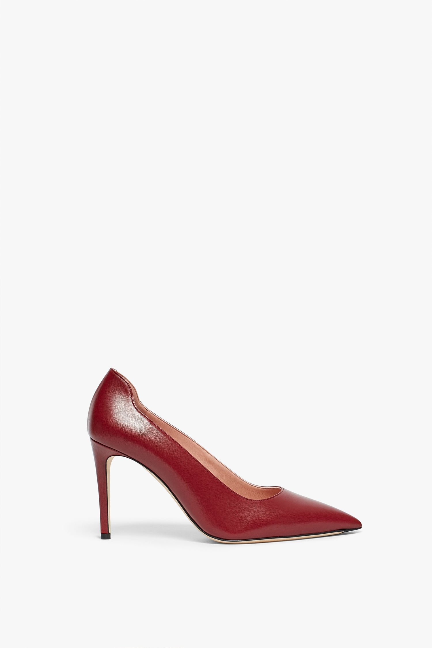 A dark red Bordeaux Victoria Beckham VB Pump 90mm in Bordeaux featuring a pointed toe and a sleek, 90mm stiletto heel.