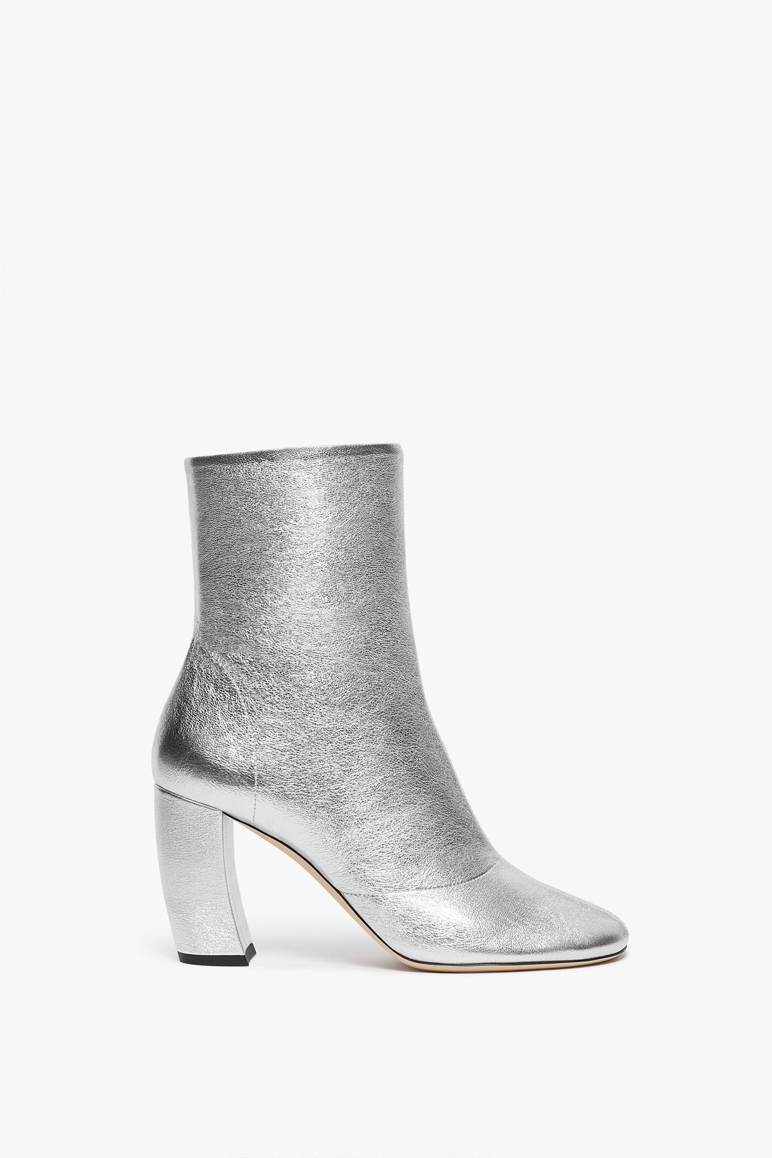 Silver metallic Capri Ankle Boot 85mm in Silver by Victoria Beckham with an 85mm block heel and a slightly rounded toe, crafted from luxurious silver nappa leather, presented on a plain white background.