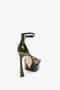 A Squared Toe Platform Sandal in Green Grained Patent with an ankle strap, featuring a sleek 100mm heel viewed from the back angle by Victoria Beckham.