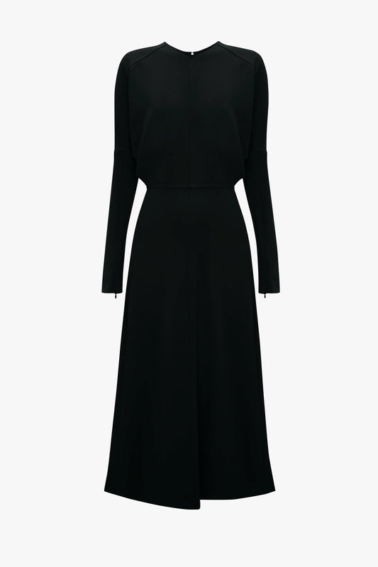 Long-sleeved Dolman Midi Dress in Black with a flared skirt and crew neckline, displayed on a white background with squared toe sandals by Victoria Beckham.