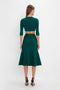 Woman in a Victoria Beckham VB Body Cropped Cardi In Lurex Green, standing against a plain white background.