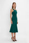 A woman is standing and wearing a sleeveless, dark green, knee-length VB Body Sleeveless Dress In Lurex Green by Victoria Beckham paired with black high-heeled sandals. The flattering flared silhouette of the dress is perfect for your new-season wardrobe. The background is plain white.