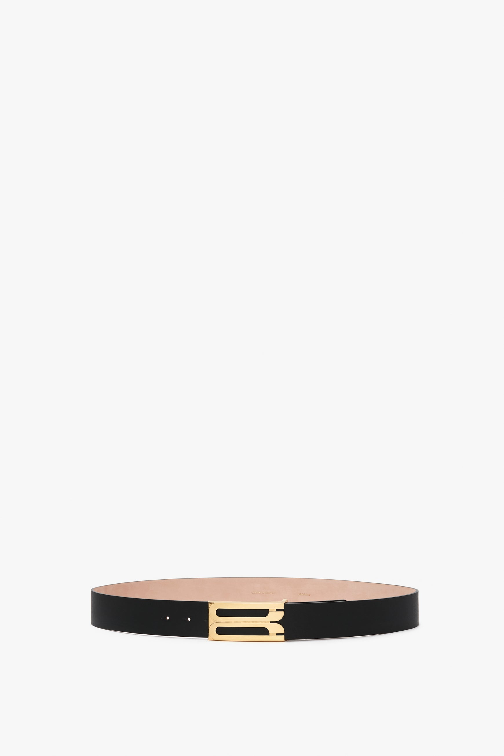 Exclusive Jumbo Frame Belt In Navy Leather by Victoria Beckham featuring smooth calf leather and a gold rectangular buckle, showcased against a white background.