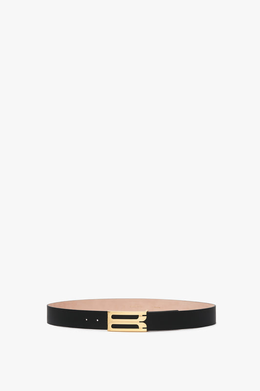 Exclusive Jumbo Frame Belt In Navy Leather by Victoria Beckham featuring smooth calf leather and a gold rectangular buckle, showcased against a white background.