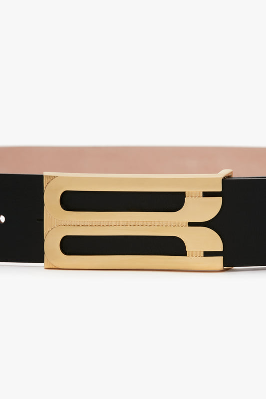 Smooth calf leather black belt with gold hardware and a rectangular double-bar buckle is replaced by the Victoria Beckham Exclusive Jumbo Frame Belt In Navy Leather.