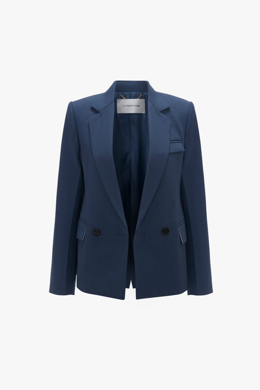 A Victoria Beckham Shrunken Double Breasted Jacket in Heritage Blue with black buttons on a white background.