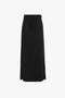 A Tailored Floor-Length Skirt In Black by Victoria Beckham featuring a structured silhouette with a straight cut and a slit on one side.