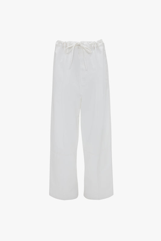 White wide-leg drawstring pyjama trousers in washed white by Victoria Beckham isolated on a white background.