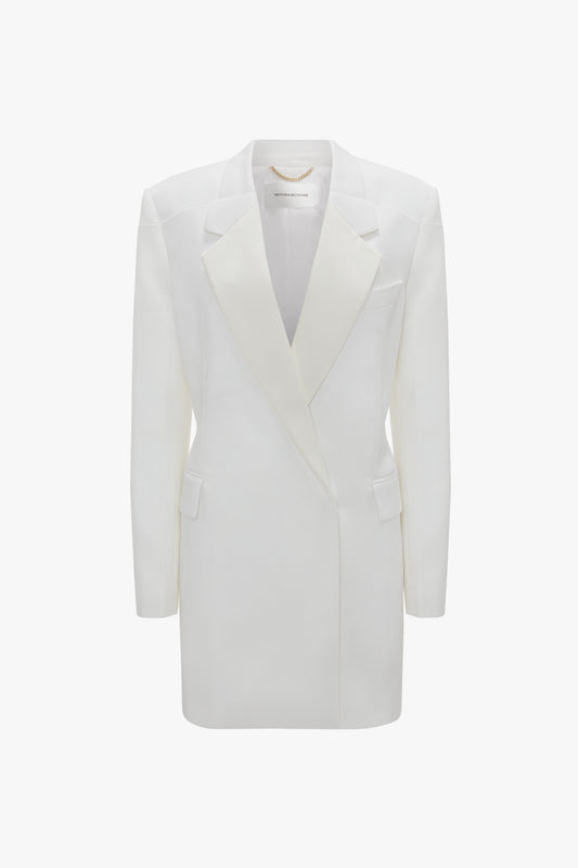 A Victoria Beckham Exclusive Fold Shoulder Detail Dress In Ivory with sharp lapels and a double-breasted cut, showcased against a plain background.