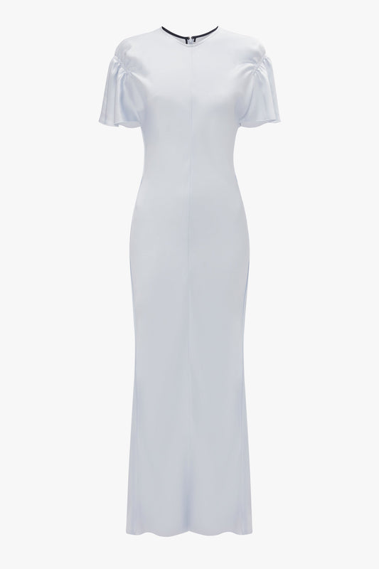 A floor-length, fitted white Gathered Sleeve Midi Dress In Ice by Victoria Beckham with short flutter sleeves, a round neckline, and a graceful crepe back satin finish.