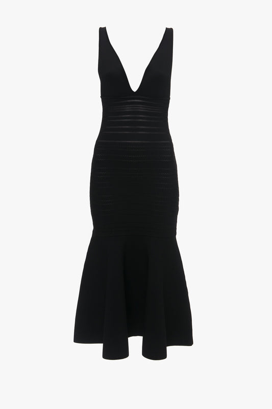 A Victoria Beckham black sleeveless bandage dress with a plunging neckline and fit-and-flare silhouette, isolated on a white background.